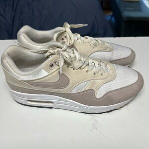 Women’s Beige and White Nike Sneakers